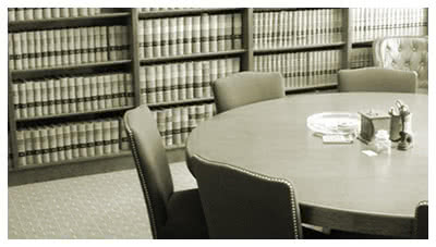 round table in a law library, representing general liability defense