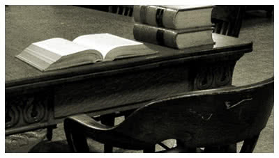 Desk with law books open, representing workers compensation